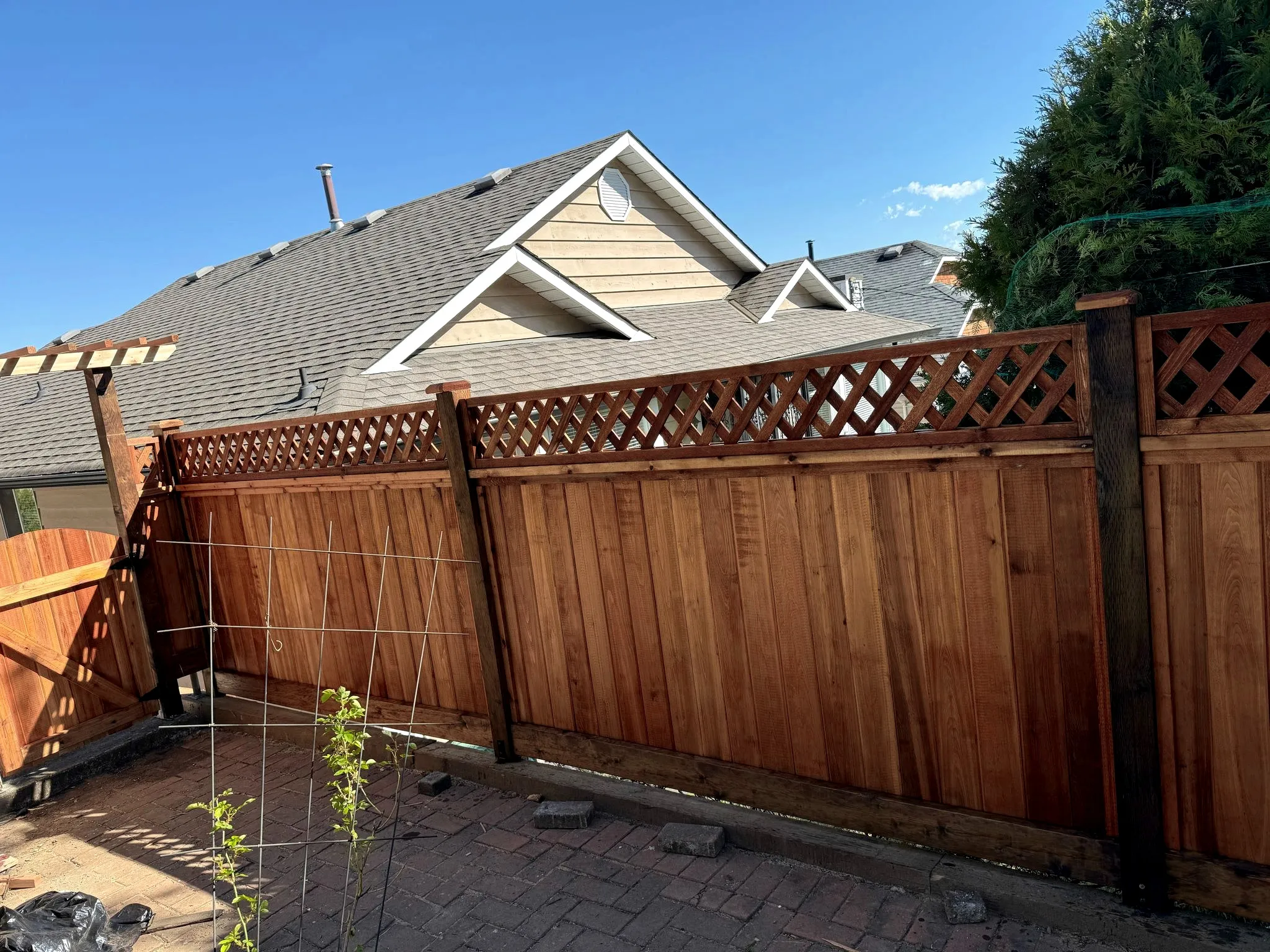 Cedar lattice-top fence beside a patio